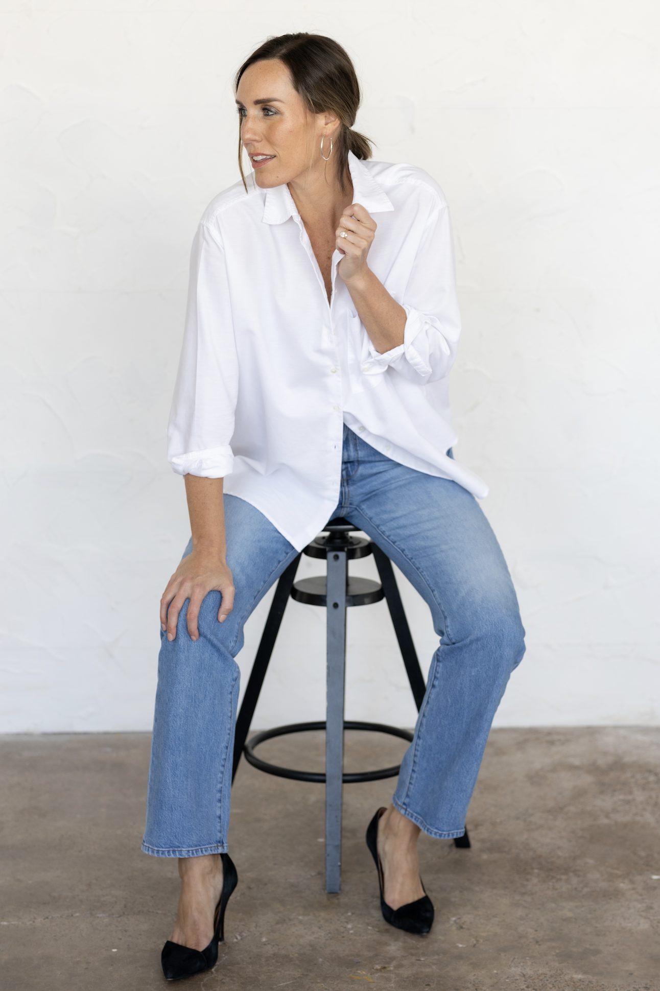 Anne Liebman, founder of SheStylesCo. Wearing classic white button-down shirt.
